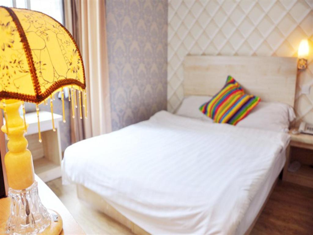 Qingdao Four Seasons Sunshine Business Hotel צ'ינגדאו חדר תמונה